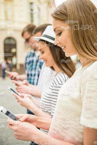 Four Friends Texting Messages Stock Photo