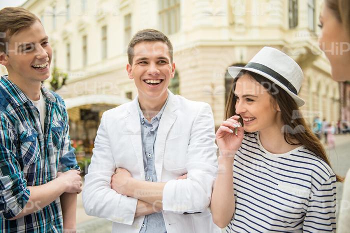 Group Of Young People Having Conversation Stock Photo