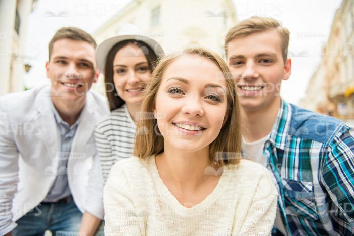 Nice Young Woman Making Picture With Her Friends Stock Photo
