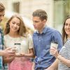 Young People Talking And Drinking Coffee Stock Photo