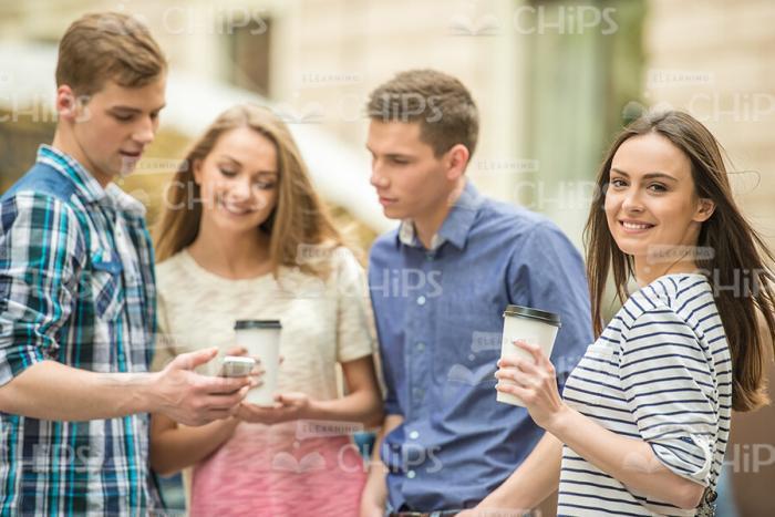 Young People Talking And Drinking Coffee Stock Photo