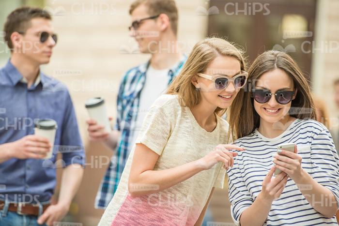 Happy Friends Are Talking To Each Other Stock Photo