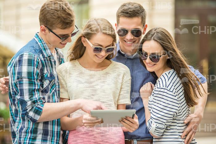 Group Of Young People Using Tablet Stock Photo