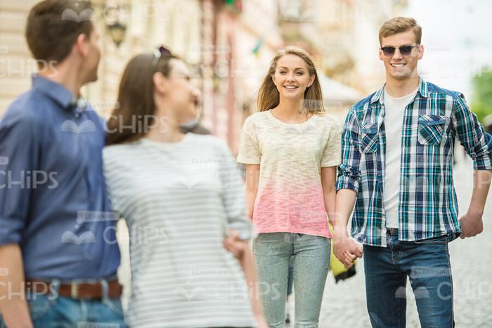 Happy Couples On Walk Stock Photo