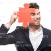 Young Man Looking Through Puzzle Piece Stock Photo