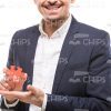 Smiling Guy Presenting Puzzle Piece Stock Photo