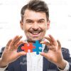 Happy Man Connected Puzzles Stock Photo On White Background