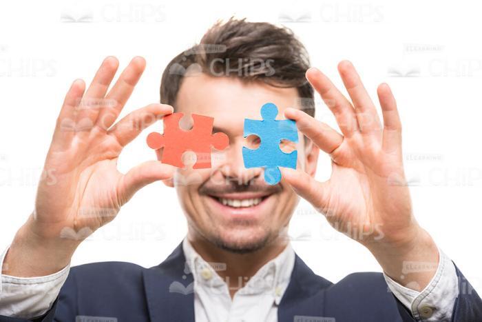 Smiling Man With Puzzles Stock Photo Isolated On White