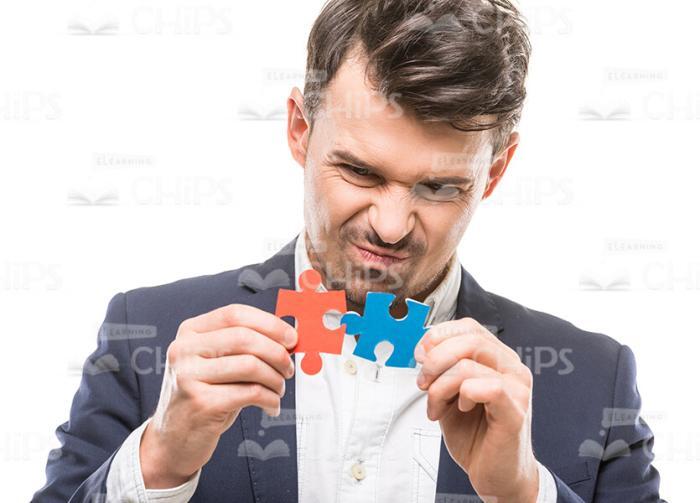 Man Connecting Puzzle Pieces White Background Stock Photo