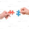Hands Going To Connect Puzzle Pieces Stock Photo Isolated On White