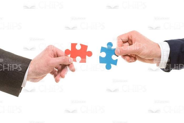 Hands Going To Connect Puzzle Pieces Stock Photo Isolated On White