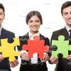 Business Team With Pieces Of Puzzle White Isolated Stock Photo