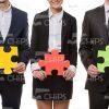 Business People On White Background Holding Puzzles Stock Photo