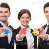 Isolated On White Smiling Business People Holding Puzzle Pieces Stock Photo