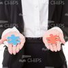Colorful Jigsaw Puzzles In Woman's Hands Stock Photo