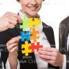 Business People Assembling Jigsaw Puzzles Stock Photo