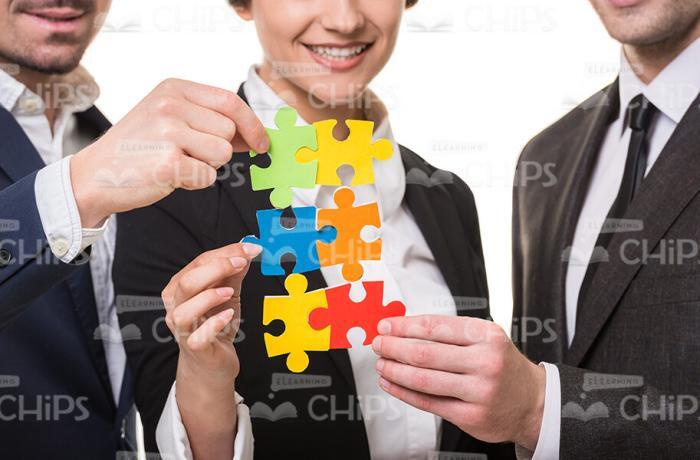 Business People Assembling Jigsaw Puzzles Stock Photo