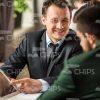 Businessmen Talking At Restaurant Stock Photo