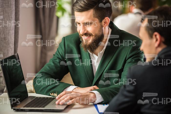 Bearded Businessman Using Tablet Stock Photo