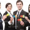Successful Business People With Puzzles Stock Photo