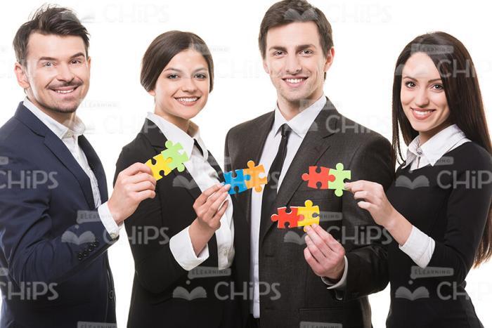 Successful Business People With Puzzles Stock Photo