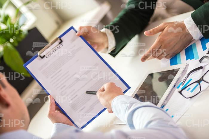 Man Pointing On Clipboard Stock Photo