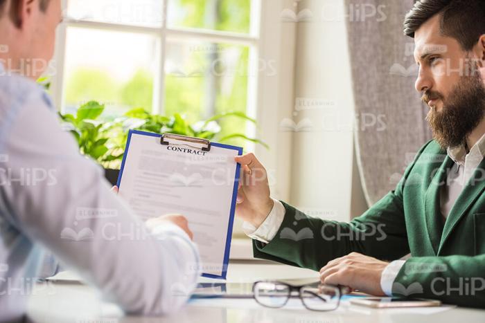 Handome Men With Clipboard Discussing Their Own Businesses Stock Photo