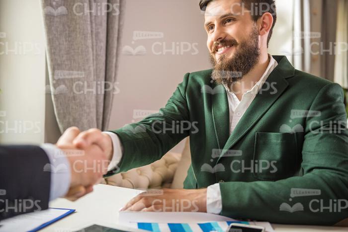 Young Businessman Shakes Hands Stock Photo
