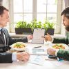 Business Men Discussing Papers Stock Photo