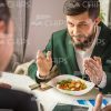 Partners Talking About Business During Lunch Stock Photo