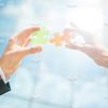 Hands Holding Jigsaw Puzzles Stock Photo