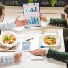 Businessmen Discussing During Lunch Stock Photo