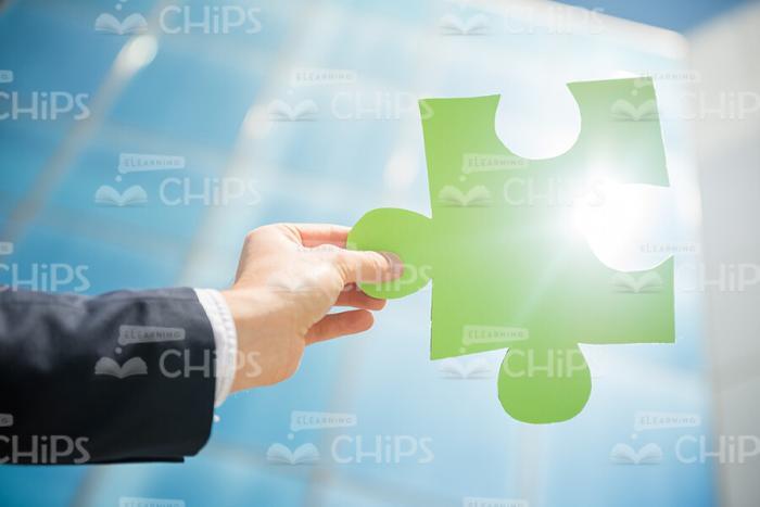 Hand Holds Big Puzzle Piece Stock Photo