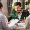 Bearded Businessman Spreads Hands Stock Photo