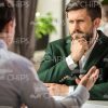 Thoughtful Businessman At Restaurant Stock Photo