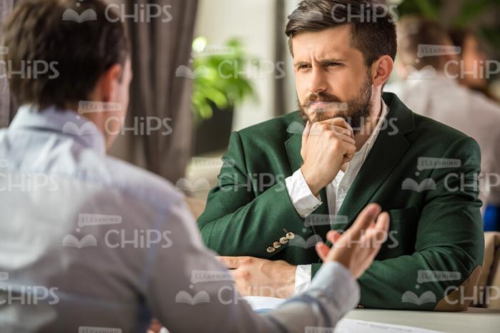 Thoughtful Businessman At Restaurant Stock Photo