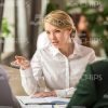 Pretty Businesswoman Explains Something Stock Photo