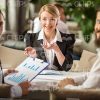 Stock Photo Of Business Team With Clipboard Turns To Camera