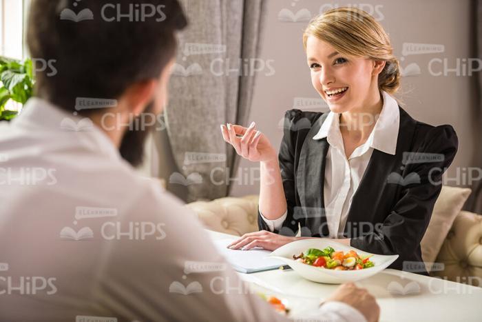 Business Woman Talking During Lunch Stock Photo