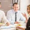 Business Partners At Restaurant Stock Photo