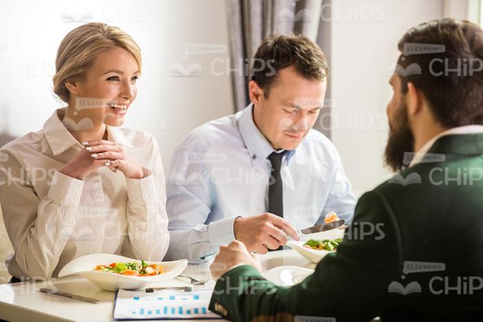 Smiling Business People Having Lunch Time Stock Photo