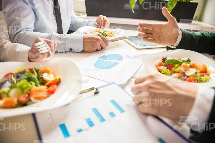 Businessmen Talking About Businesses During The Lunch Stock Photo