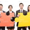 Young Business People With Two Big Pieces Of Puzzle Stock Photo