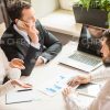 Partners Discussing Common Businesses Stock Photo