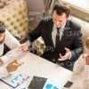 Businessmen Gesturing And Explaining Something To His Partners Stock Photo