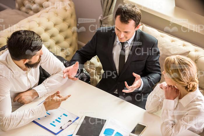 Businessmen Gesturing And Explaining Something To His Partners Stock Photo