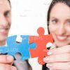 Handsome Business Partners Connecting Jigsaw Puzzles Stock Photo