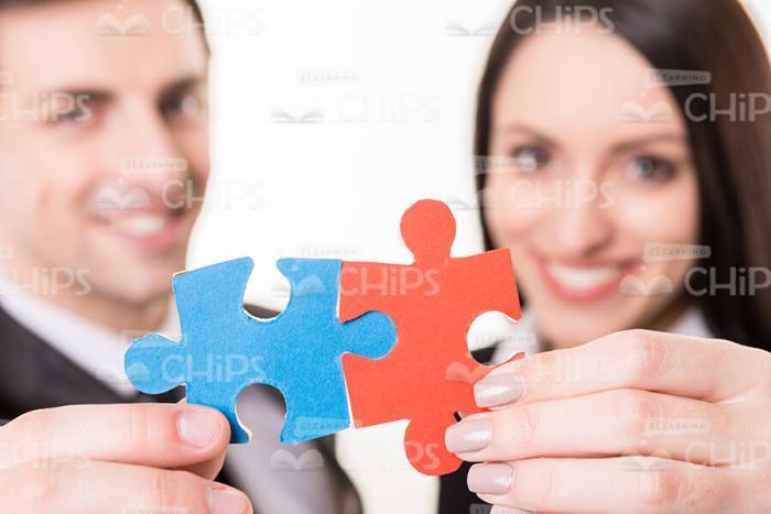 Handsome Business Partners Connecting Jigsaw Puzzles Stock Photo