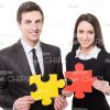 People Showing Pieces Of Puzzle Stock Photo