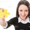 Young Lady With Yellow Jigsaw Puzzle Stock Photo